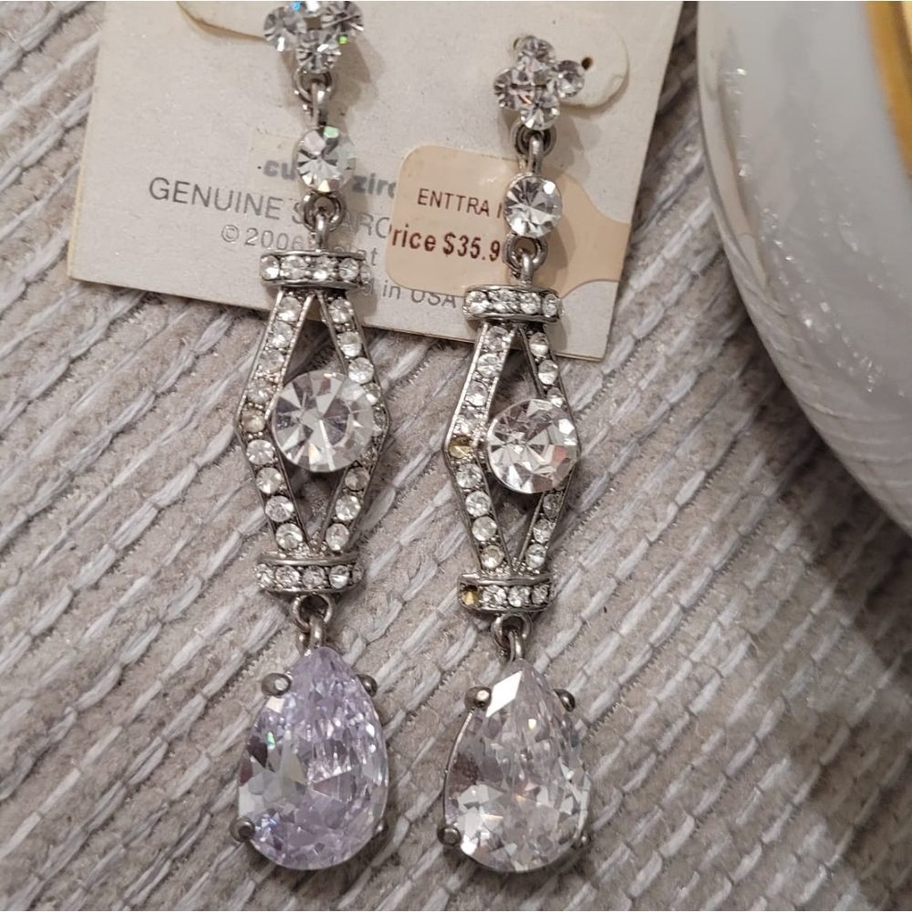Designed in New York crystal ENTTRA Post at back I